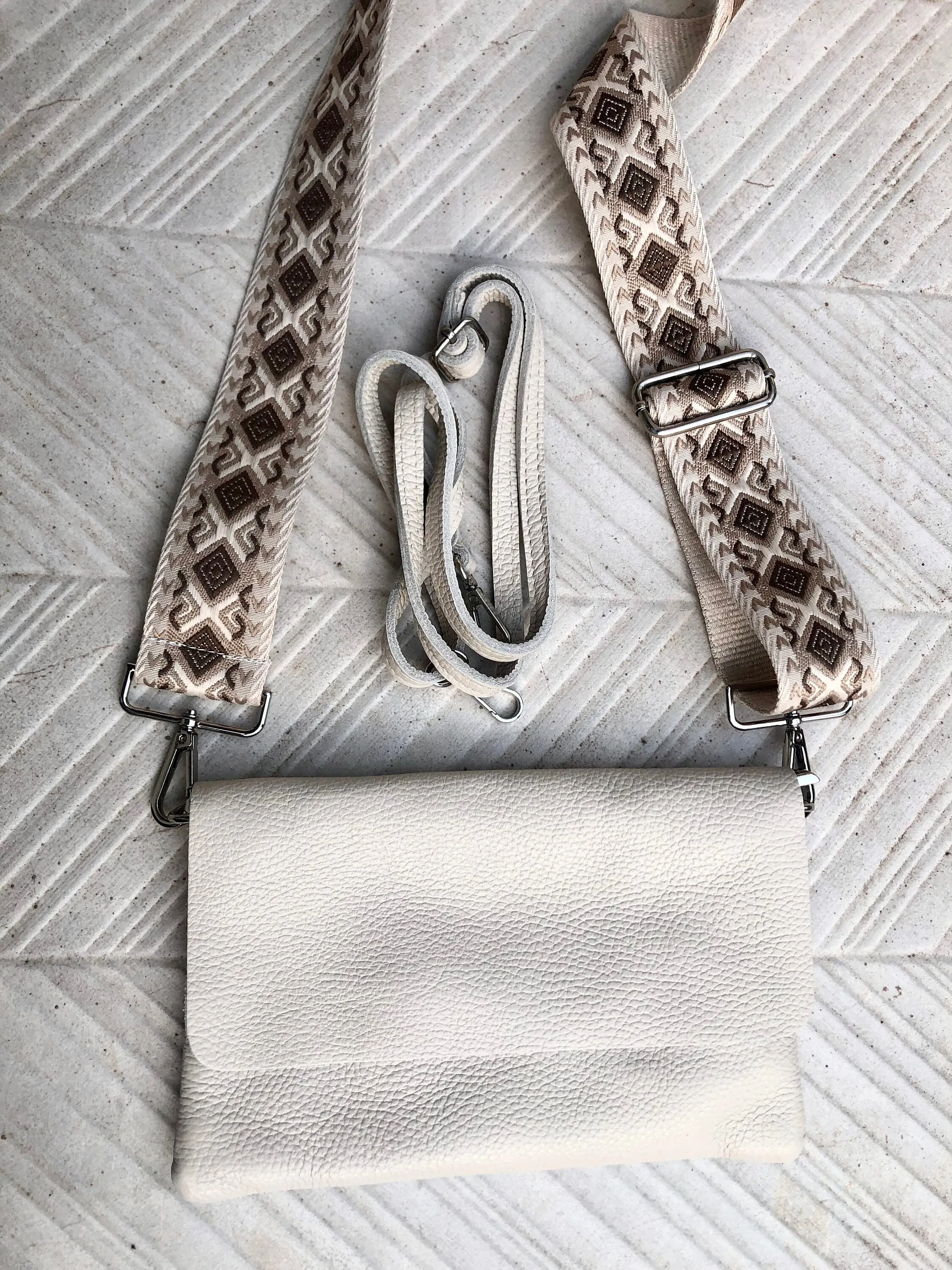 Cream color small leather bag. 2 straps: 1 leather   1 guitar strap. GENUINE leather Crossbody / shoulder bag. Light beige purse with flap