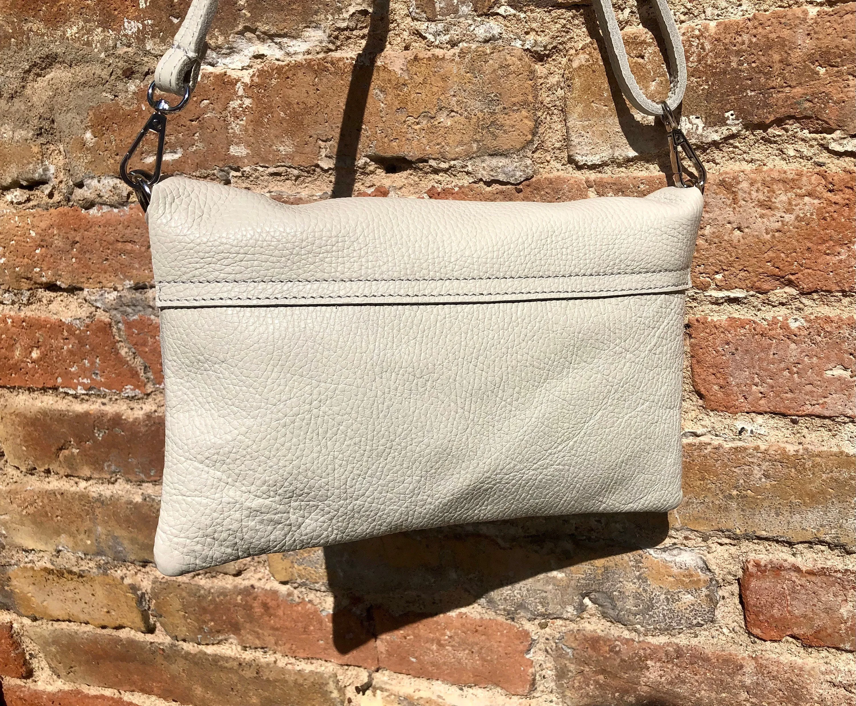 Cream color small leather bag. 2 straps: 1 leather   1 guitar strap. GENUINE leather Crossbody / shoulder bag. Light beige purse with flap