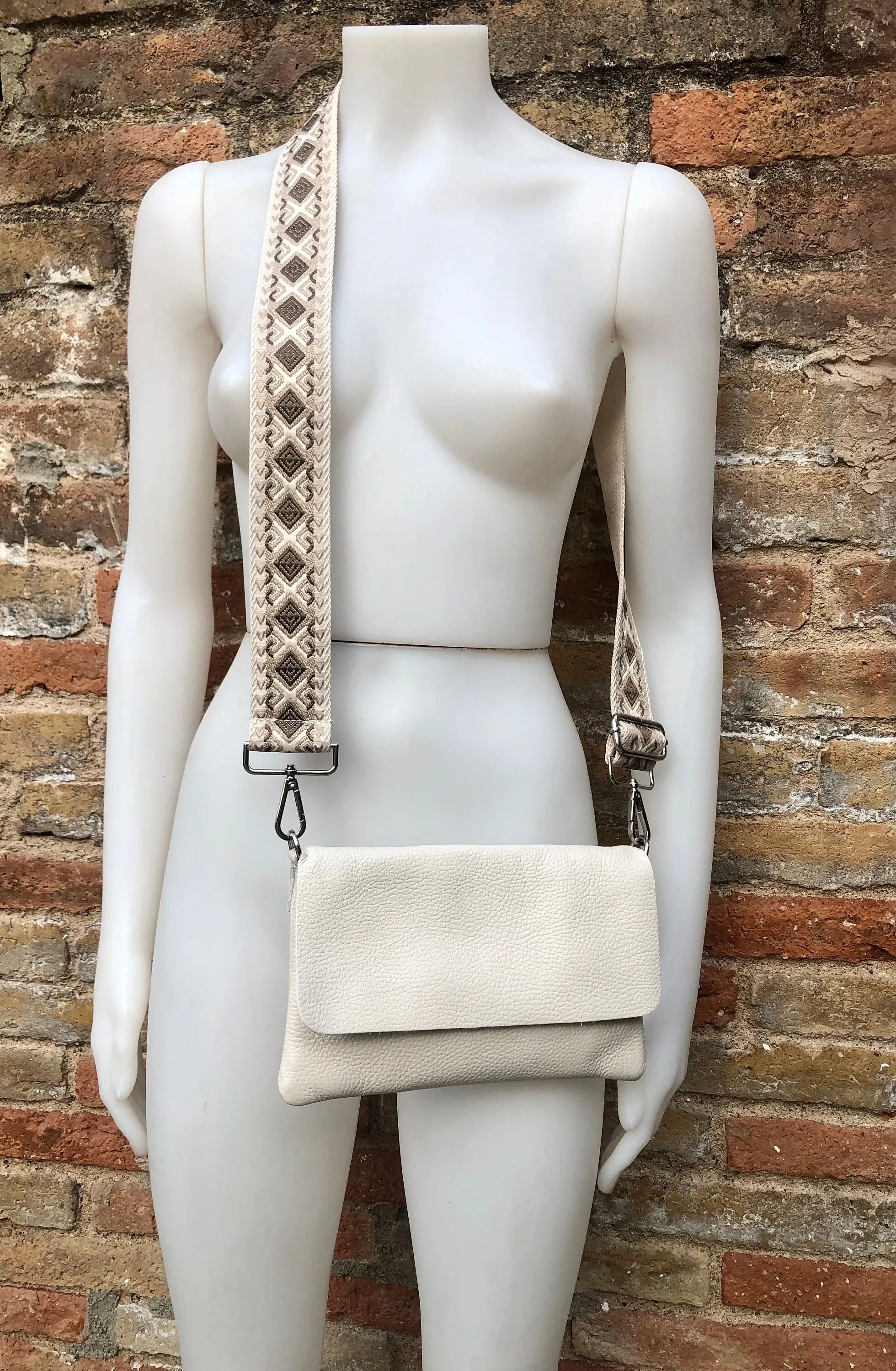 Cream color small leather bag. 2 straps: 1 leather   1 guitar strap. GENUINE leather Crossbody / shoulder bag. Light beige purse with flap