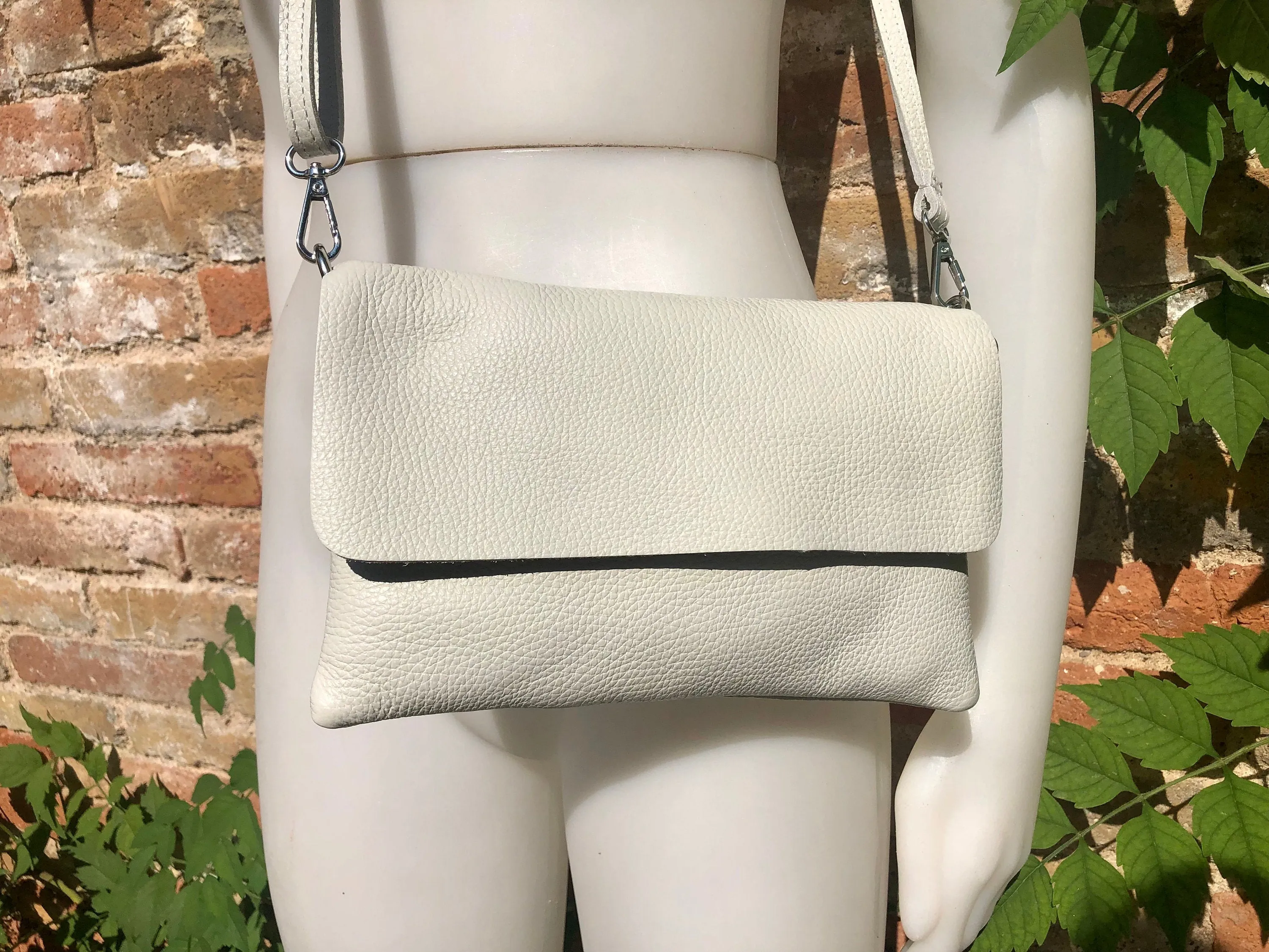 Cream color small leather bag. 2 straps: 1 leather   1 guitar strap. GENUINE leather Crossbody / shoulder bag. Light beige purse with flap