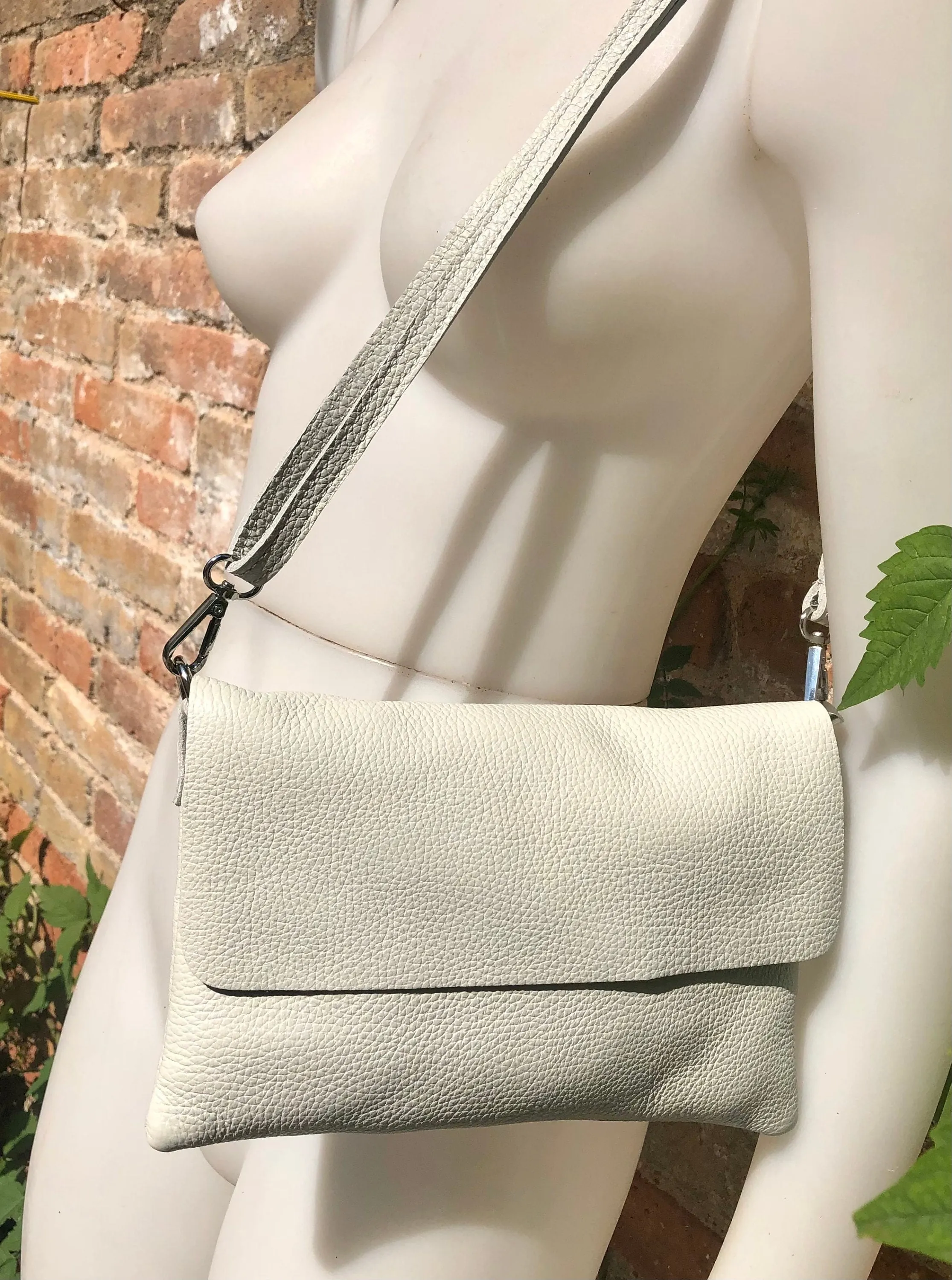 Cream color small leather bag. 2 straps: 1 leather   1 guitar strap. GENUINE leather Crossbody / shoulder bag. Light beige purse with flap